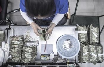 &ldquo;無現(xiàn)金&rdquo;進(jìn)程中的公交點(diǎn)鈔員